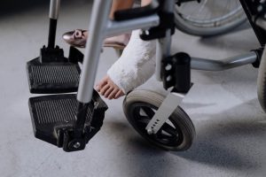 injured girl sitting on a wheelchair